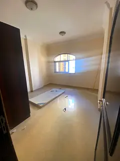 2BR apartment for rent in Al Khan Sharjah, kitchen with balcony, prime location near services, price