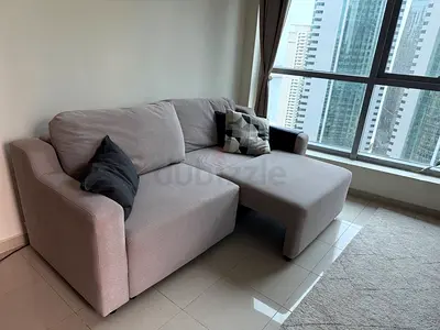 Light grey L-shaped sofa with chaise, good condition