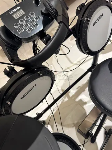 My electronic drum kit with module and headphones