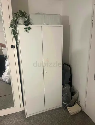 Compact white two-door wardrobe — used, good condition