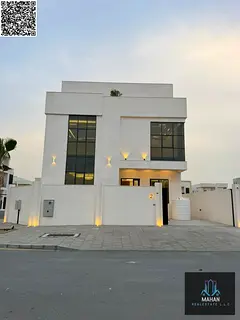 A luxurious villa situated on a corner lot, featuring a modern design, high-end finishes, and a gard