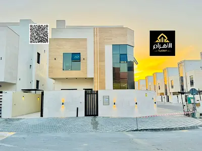 Villa for sale | Villa on two streets | In Al Helio 2, Ajman | High-quality designs and finishes | Glass stone facade | Price includes registration an