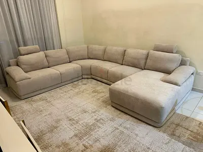 Spacious and cozy L-shape sofa, designed for comfort with wide seating and supportive back cushions.