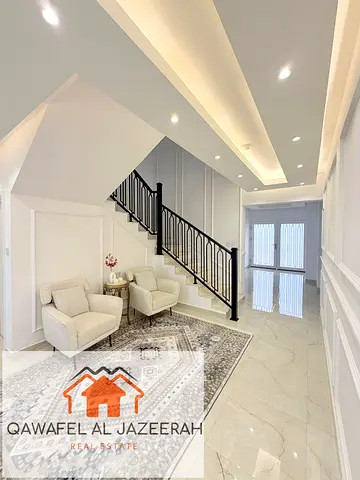 Very nice villa for rent in al warqaa ( 5bedroom + hall + majlas + parking + service block )