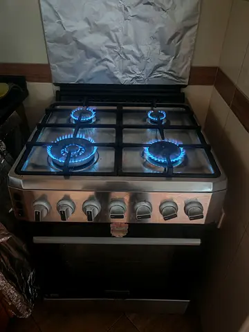 My 4-burner stainless steel gas cooker with oven - working condition