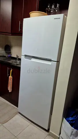 Samsung white top-freezer refrigerator — working condition