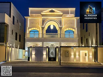 Opportunity to own a two-story villa in the most prestigious area of ​​Ajman, with a rooftop, internal elevator, electricity, and water directly on th
