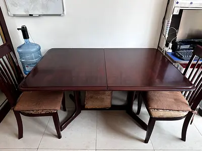 Dark wood extendable dining table with 4 chairs