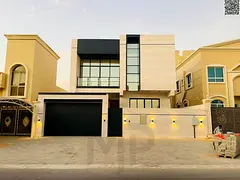 Villa for sale in Ajman, Al Helio area. 5 master bedrooms, majlis, living room, and maid's room.