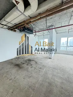 Spacious office with garden and lake view, free parking, and flexible payment options in Al Majaz 2.