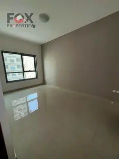 Room and living room for annual rent in Ajman, in the Emirates City, first tenant, new building, bal