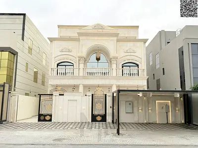Opportunity to own a two-story villa in the most prestigious area of ​​Ajman, with a rooftop, internal elevator, electricity, and water directly on th