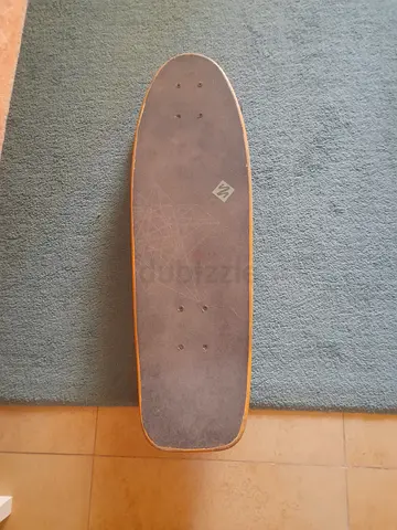 Used surf skateboard — solid deck, ready to ride