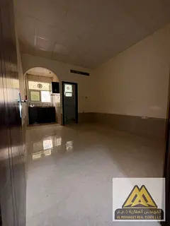Studio apartment for annual rent in Al Jurf 2, Ajman. Ground floor, spacious, central air conditioni