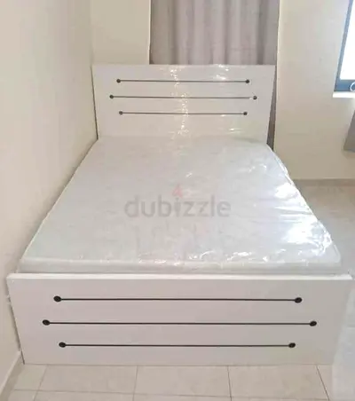 White single bed frame with mattress (mattress still wrapped)
