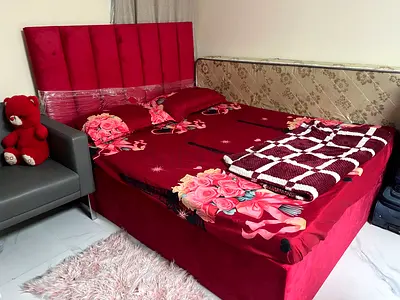 Red upholstered Queen bed with headboard and mattress  Cupboard