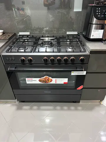 Used black freestanding gas range with oven - good working condition