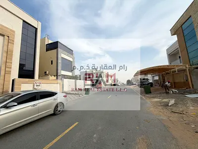 Luxury villa for sale in Al Yasmeen | 3 floors with rooftop | Ideal for living or investment