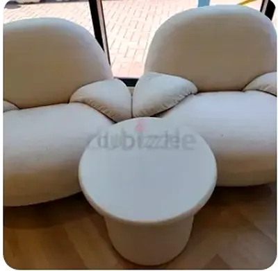 Two modern lounge armchair and cofee table