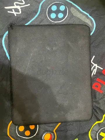 Black stitched-edge mouse pad - used
