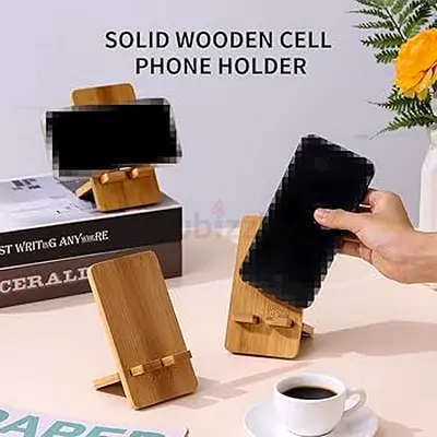 Solid bamboo phone stand I use — adjustable wooden desk holder