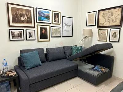 sofa bed with hidden storage for blankets and pillows.