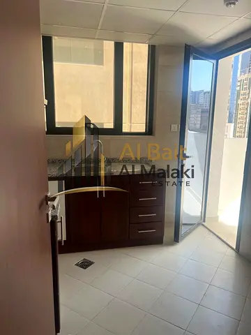 Two bedrooms and a living room in Al Taawun, directly on the Dubai exit. Master bedroom and