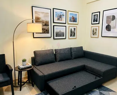 Stylish and practical sofa bed with hidden storage for blankets and pillows.