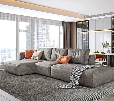 New grey L-shaped sectional sofa — spacious and well-maintained