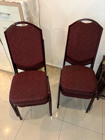 Pair of stackable banquet chairs - maroon upholstered