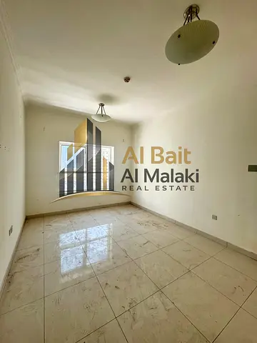 Annual Apartment for Rent • Location: Al Khan • Consists of: • Two bedrooms • Laundry room • 2 bathrooms • Payment Plan: 4 cheques