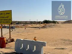 commercial land prime location (G+2) Steps away from the main street 97 , near the school