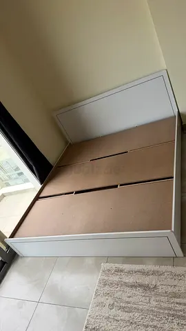 White platform storage bed frame — good condition