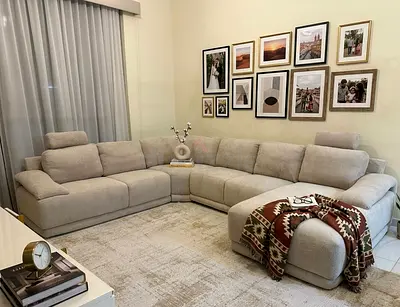 Stylish L-shape sectional sofa with premium fabric finish. Perfect for modern living rooms with $%&a