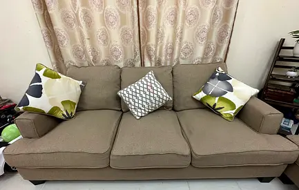 Comfortable Beige Sofa with Decorative Cushions