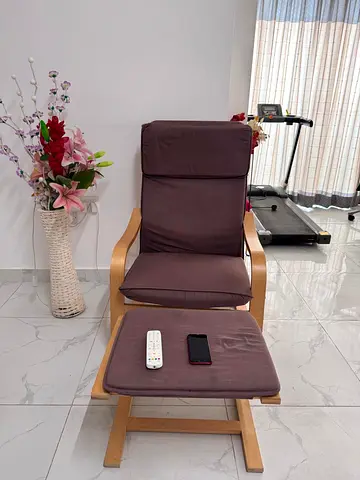 My comfy wooden-frame armchair with matching footstool