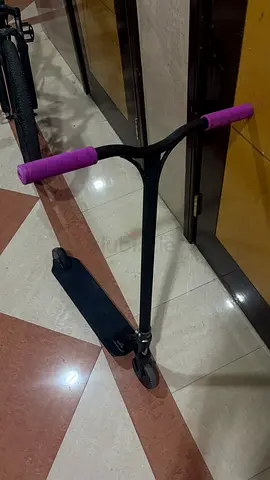 Stunt/kick scooter with purple grips — used, working