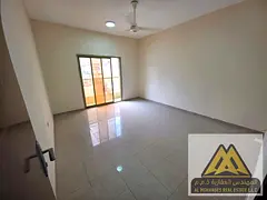 The apartment features a practical layout with two balconies offering open views, and two bathrooms