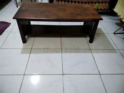 Solid wooden bench with lower shelf — used