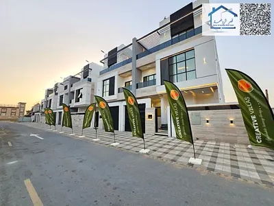 For sale in Al Talla, Ajman: A luxurious 5-bedroom villa with a rooftop terrace and elevator. Prime location behind Habitat School. Freehold ownership