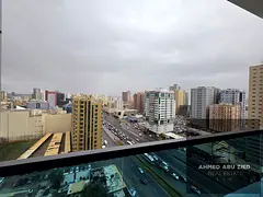 Furnished two-bedroom apartment with a living room and open view in Gulf Towers, Rashidiya 1 | Well-