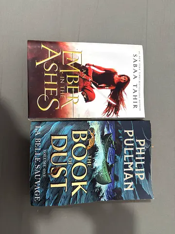 2 novels — An Ember in the Ashes  The Book of Dust: La Belle Sauvage
