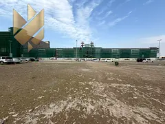 Land for rent ((Parking)) in Al Nahda, on a main street, corner location, excellent site and competi