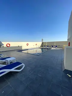 Two bedrooms and a living room in Lavender Tower, Emirates City, directly on Sheikh Mohammed Bin Zay