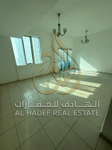 Two-bedroom apartment with a living room - separate hall with a hallway and free parking in Al Majaz 3 area. Excellent size, very close to Etisalat.