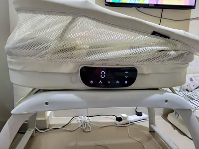 My bedside electronic bassinet with mesh sides — used