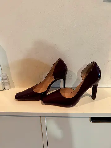 My maroon patent leather high-heel pumps