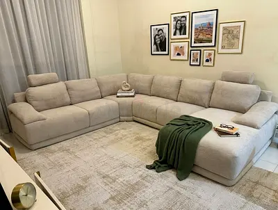 Comfortable corner sofa set featuring soft cushions and durable upholstery. Ideal for family gatheri