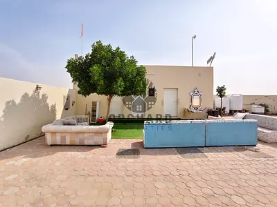 Prime location 10,000 sqft open yard with 2 rooms and electricity connection available for rent at AED 125,000 per year.