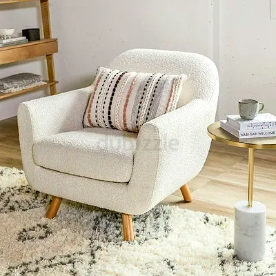 White bouclé accent armchair with solid wooden legs